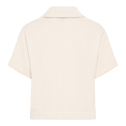 Off-white relaxed fit organic cotton terry short-sleeve shirt by Little Mariner with button-up front.