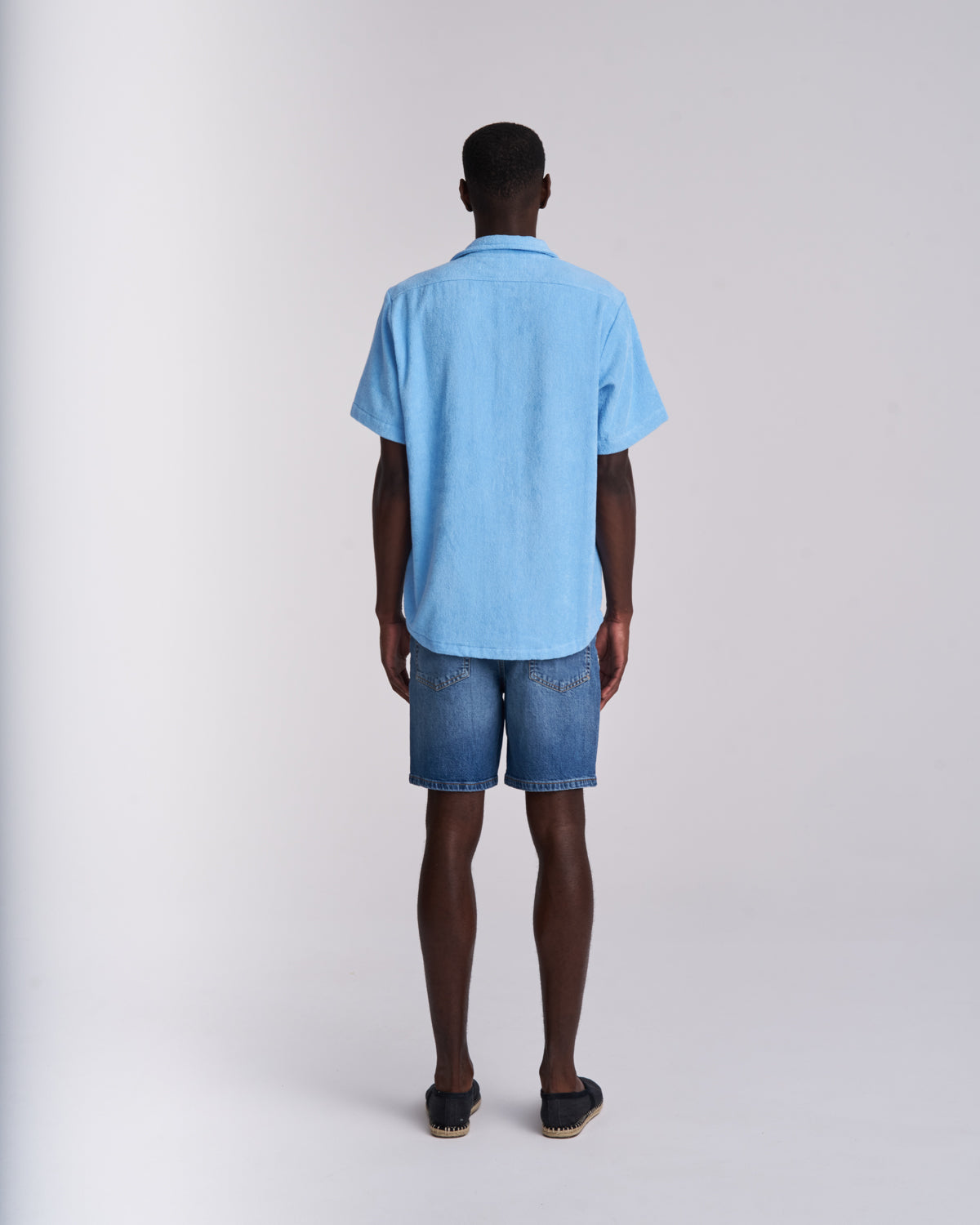 Back view of a Coastal Blue men's organic cotton terry camp-collar shirt