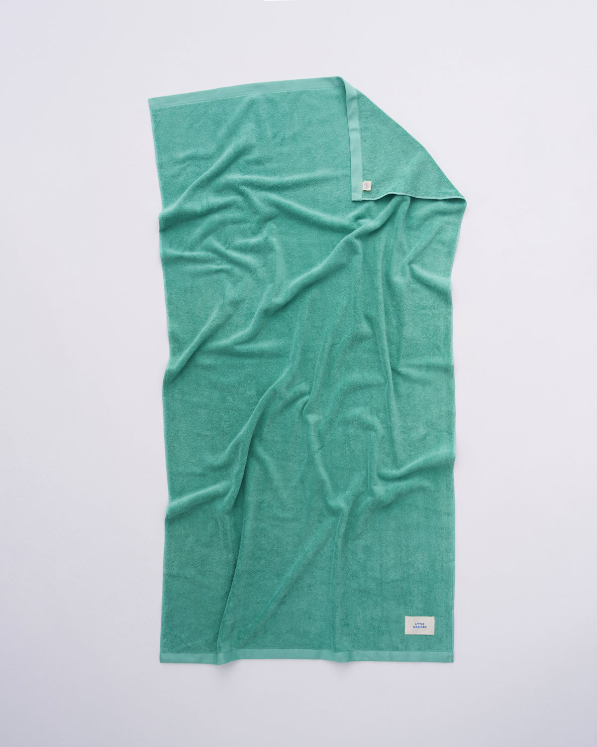 Sage Green organic cotton terry towel spread flat showing its full size