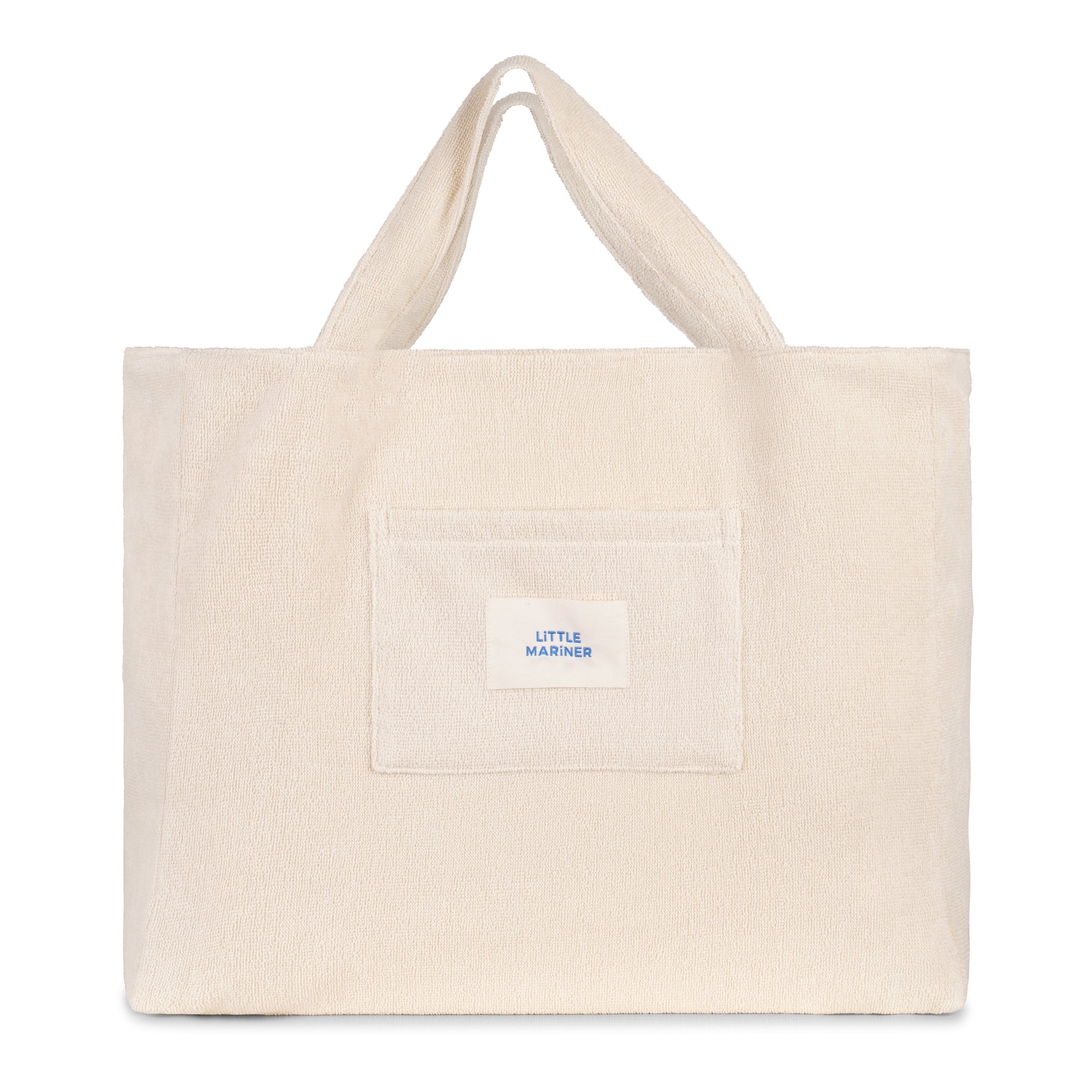 Off-white reversible organic cotton terry beach bag by Little Mariner with front patch pocket and branded label.
