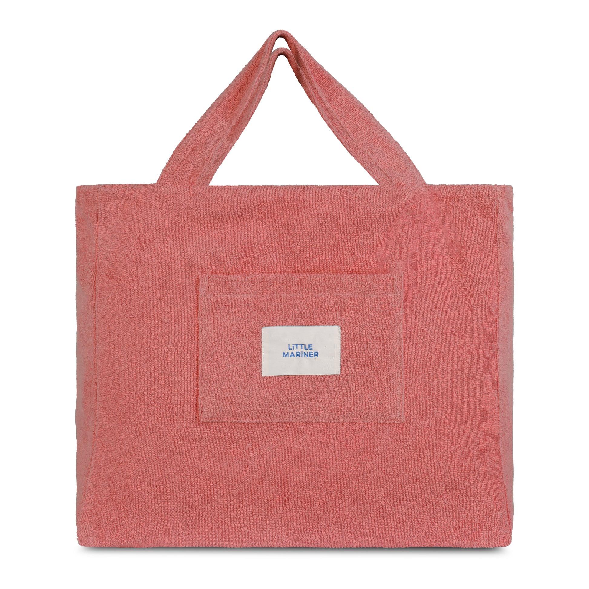 Dusty rose reversible organic cotton terry beach bag by Little Mariner with front patch pocket and branded label.