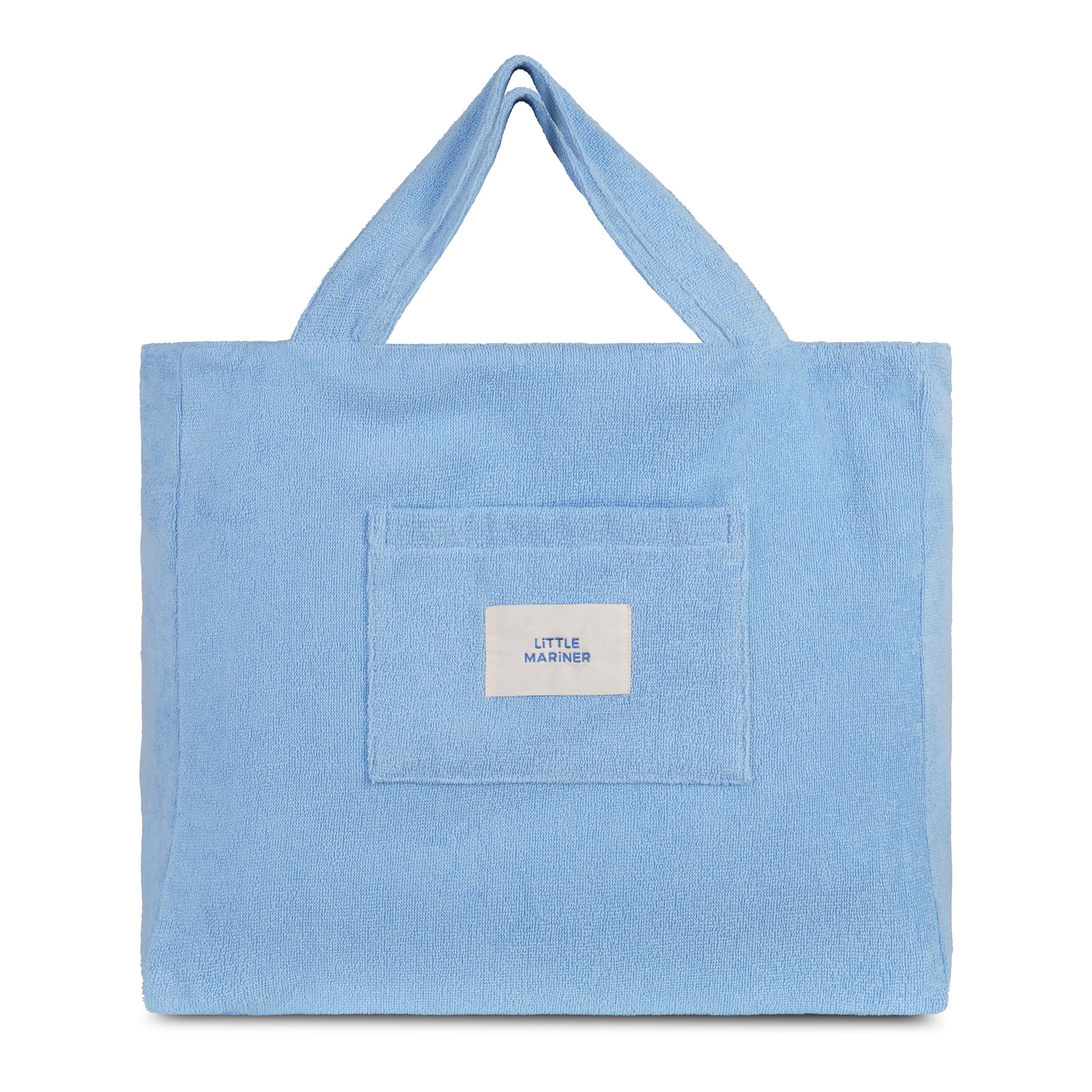 Coastal blue reversible organic cotton terry beach bag by Little Mariner with front patch pocket and branded label.