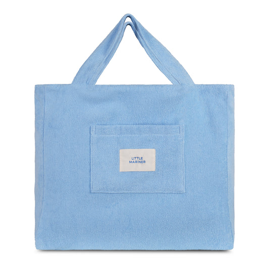Coastal blue reversible organic cotton terry beach bag by Little Mariner with front patch pocket and branded label.