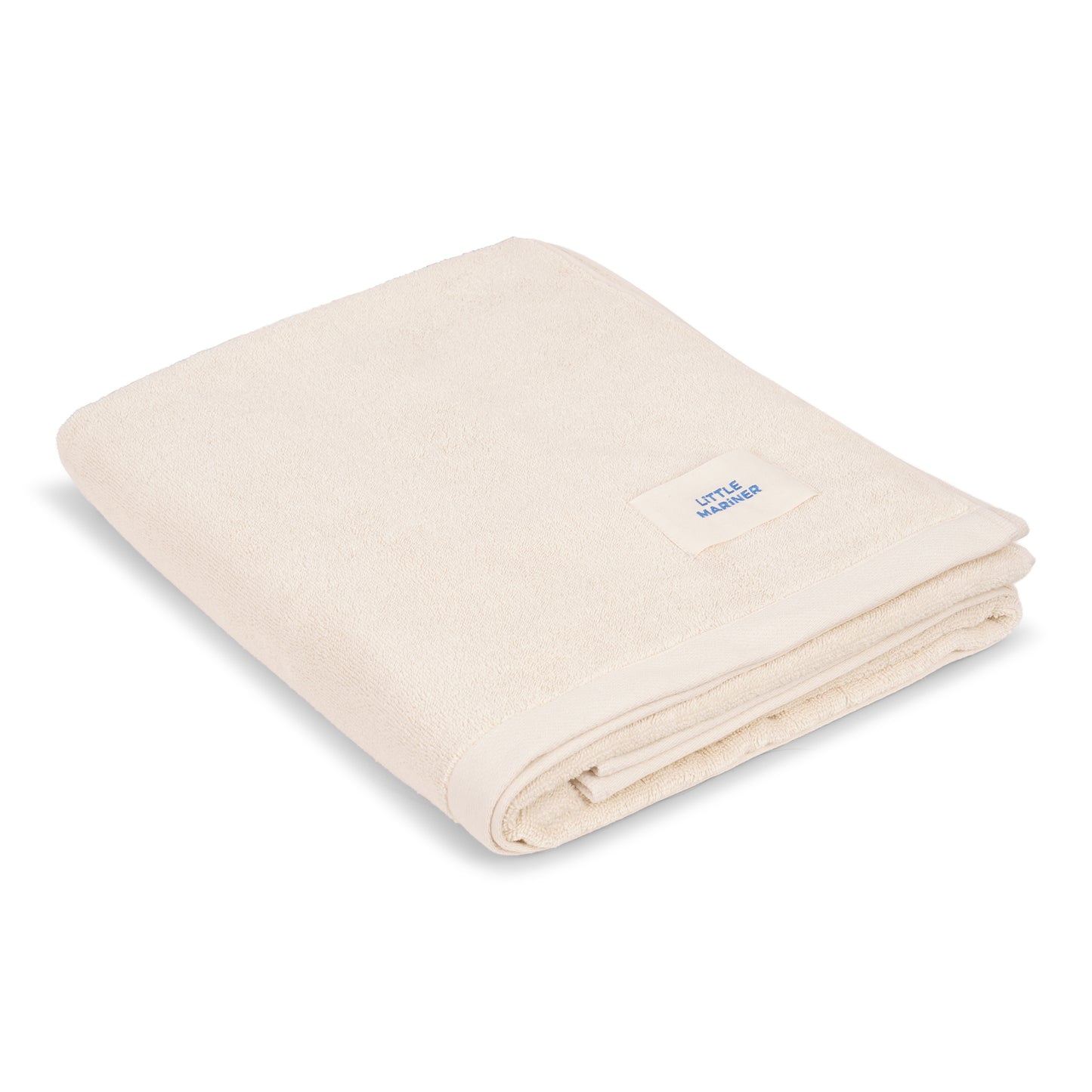 Folded off-white premium organic cotton terry towel by Little Mariner with branded label.
