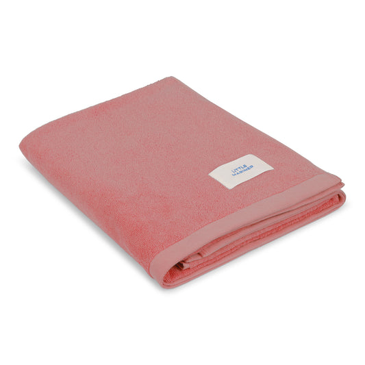 Folded dusty rose premium organic cotton terry towel by Little Mariner with branded label.