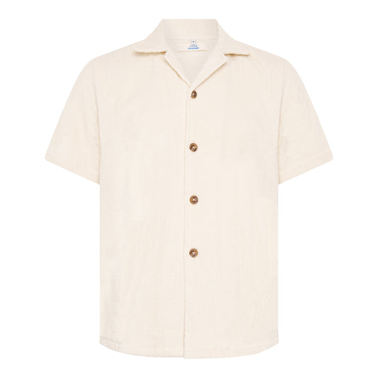 Off-white relaxed fit organic cotton terry short-sleeve shirt by Little Mariner with button-up front.