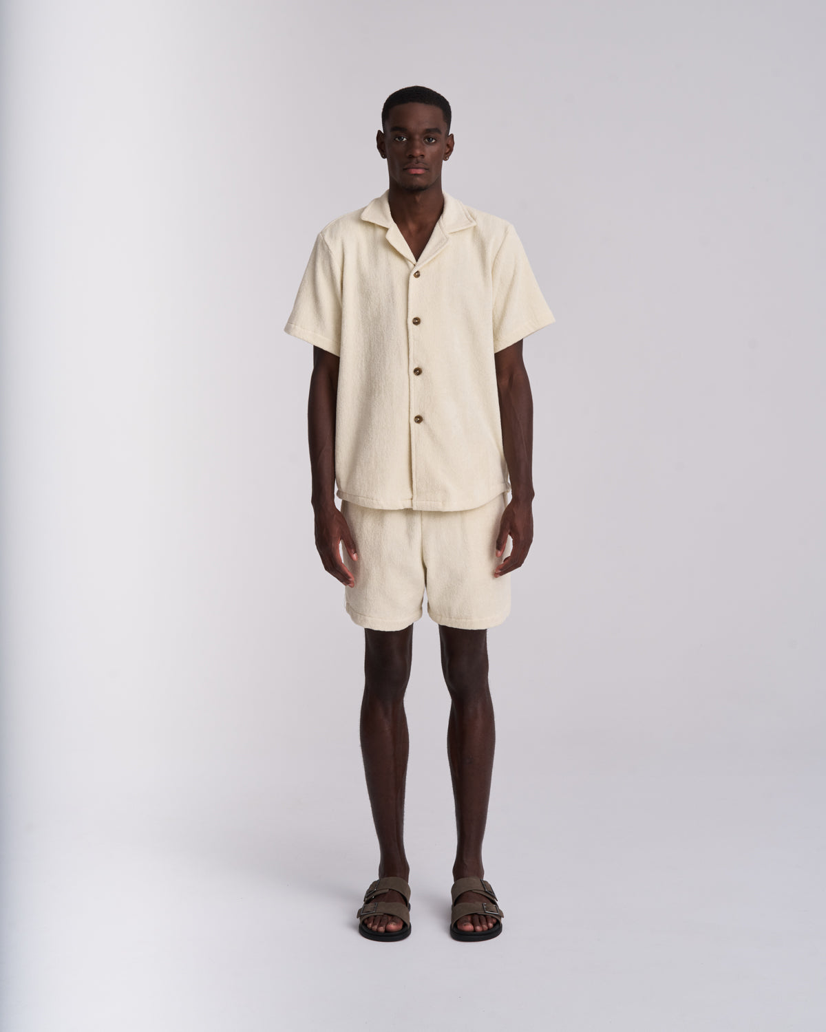 Off-White men's terry camp-collar shirt styled with matching Off-White terry shorts