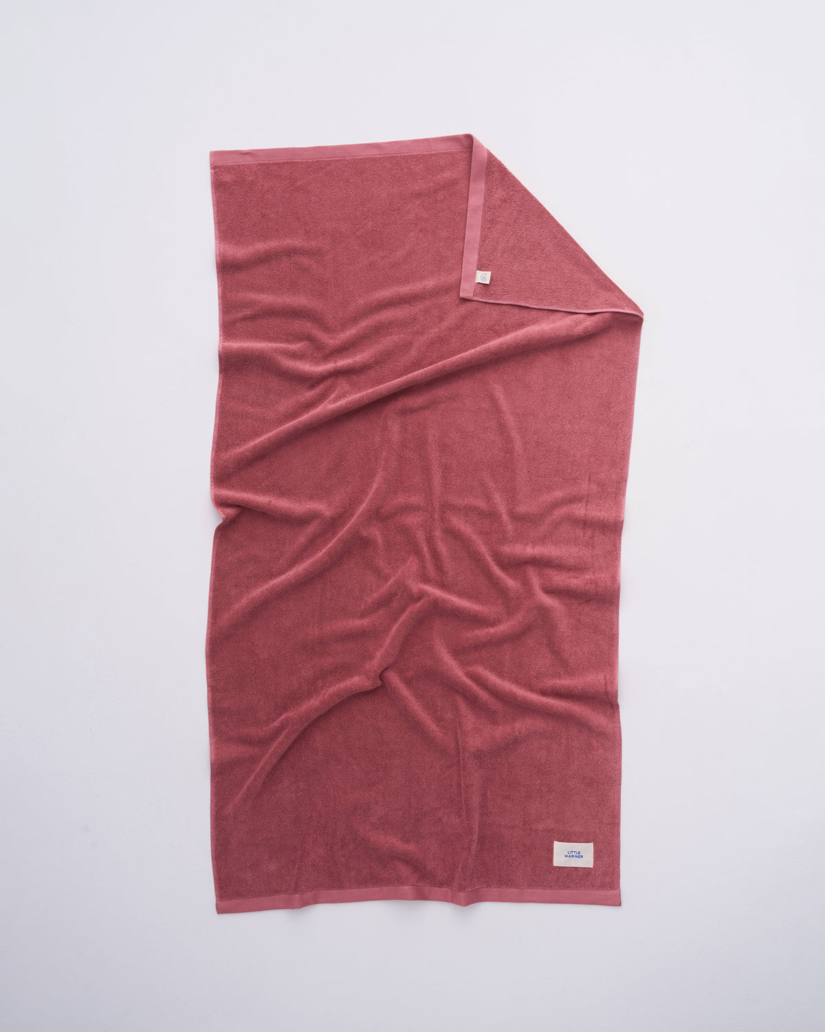 Dusty Rose organic cotton terry towel spread flat showing its full size