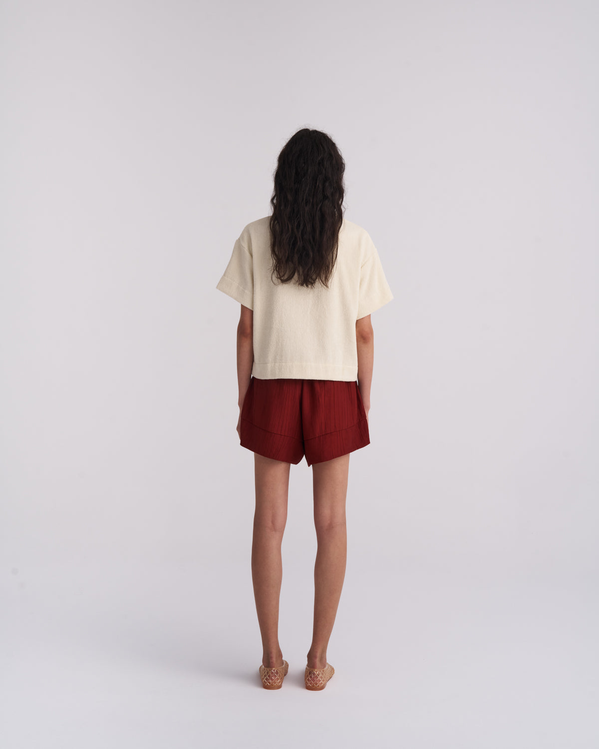 Back view of a woman in an Off-White organic cotton terry camp-collar shirt